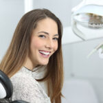 Dentist patient showing perfect smile after treatment